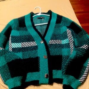 Perfect sweater for fall from VICI a plaid green cardigan with silver buttons.
